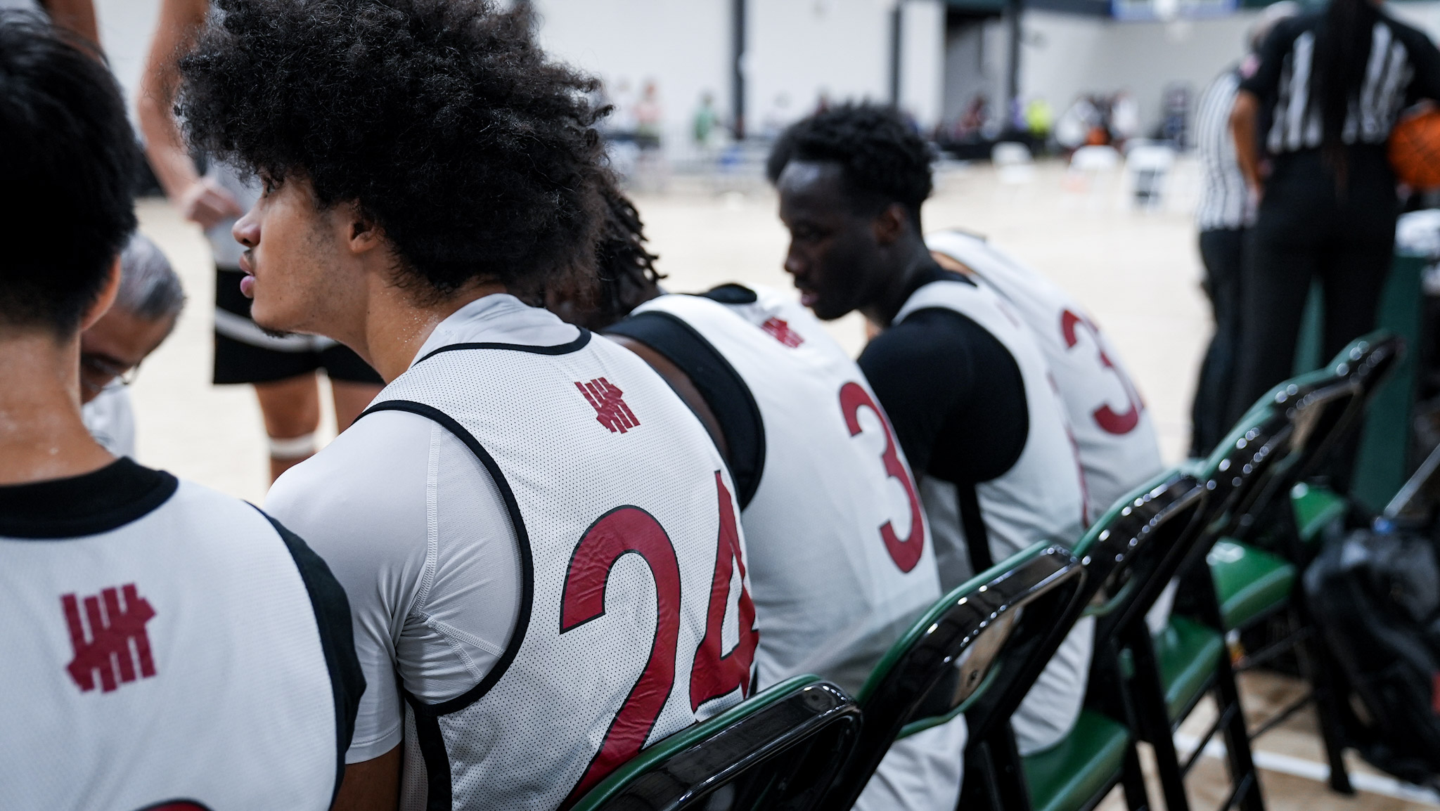 Veritas players on the bench during a game