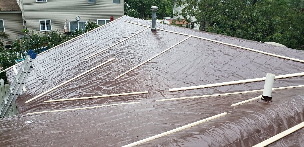 Tarp Secured With Battens