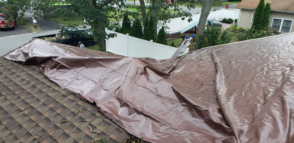Brown Tarp Over Roof Section