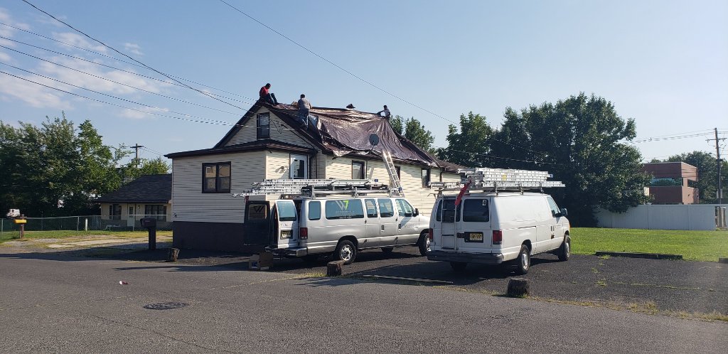 Tarp Removal — Two Vans
