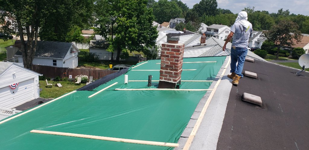 Green Tarp Nailing — Crew