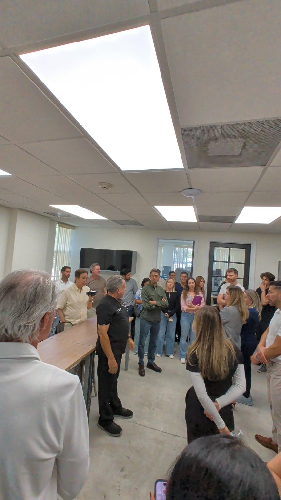 Attendees gathered around for live demonstration