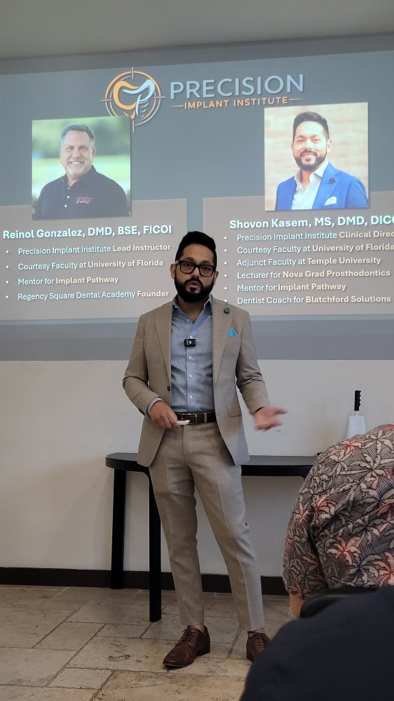 Dr. Kasem presenting to an engaged audience