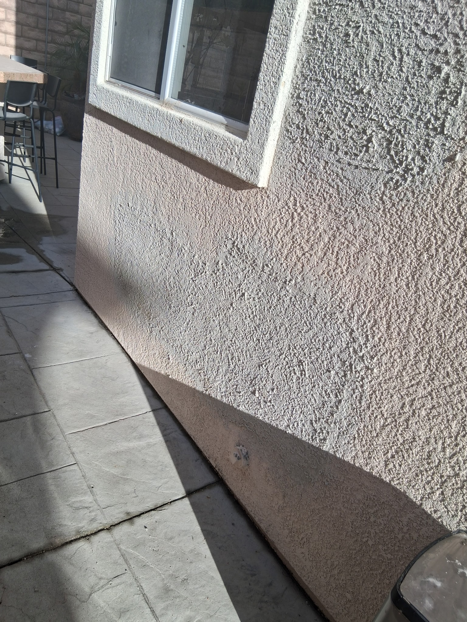 Completed stucco wall repair after copper repipe patching