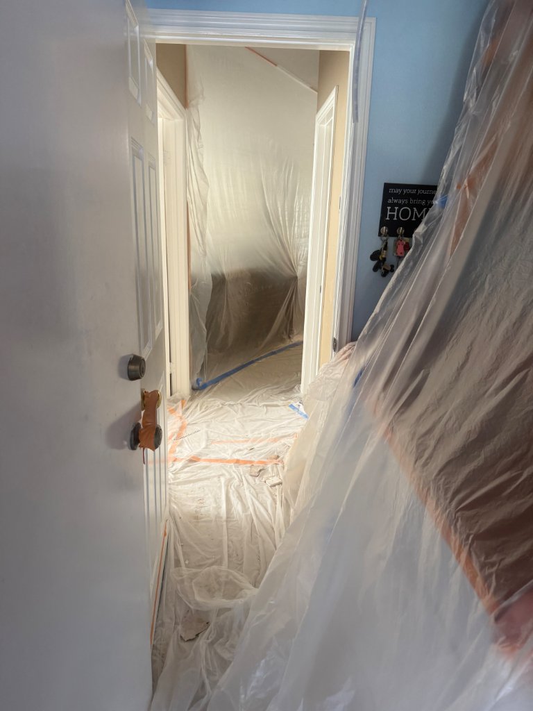 Home protection setup — hallway covered before repipe
