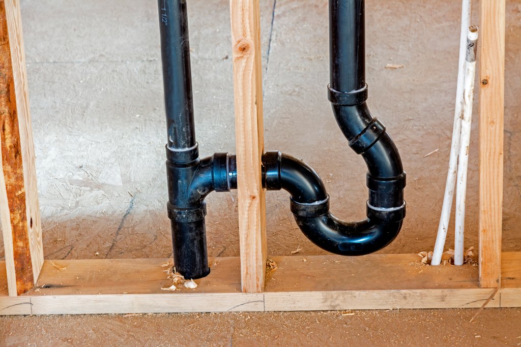 New ABS drain and P-trap installation in wall cavity