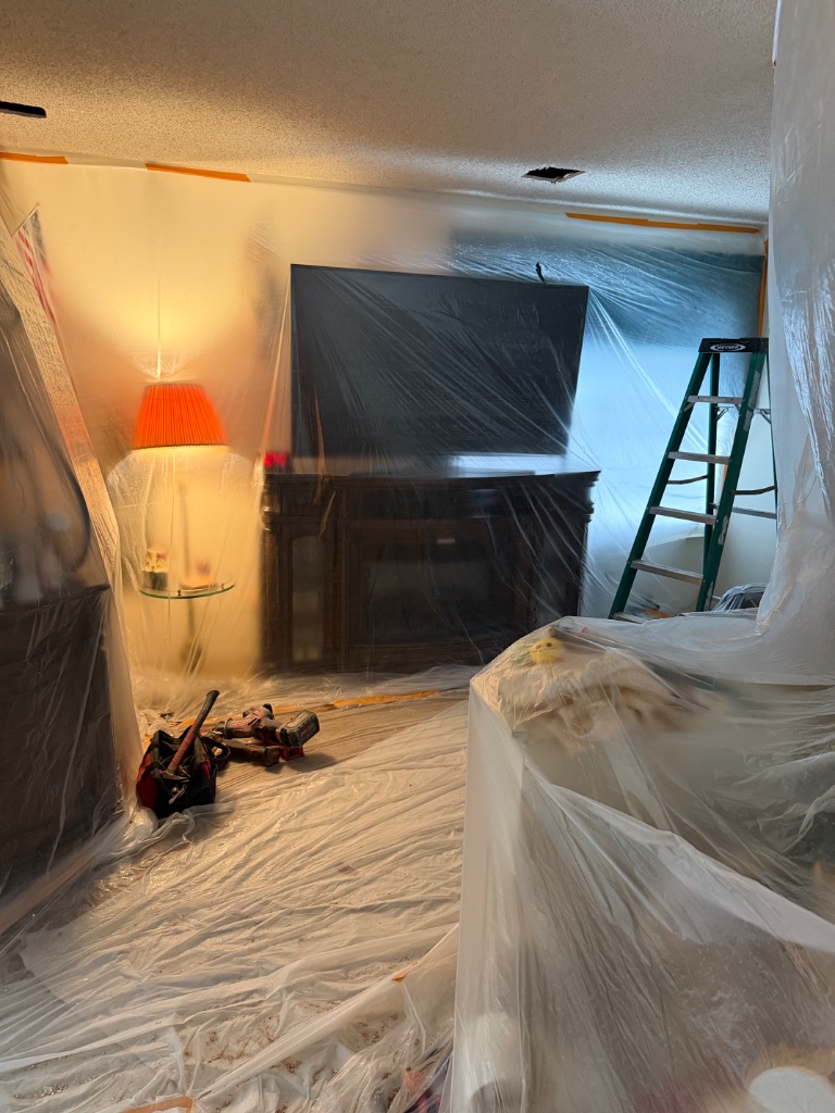 Kitchen cabinets and ceiling access opening with protection in place