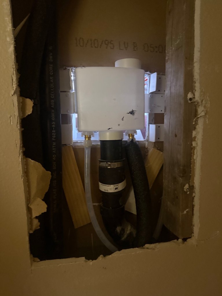 Inside wall cavity — new PEX connection installed