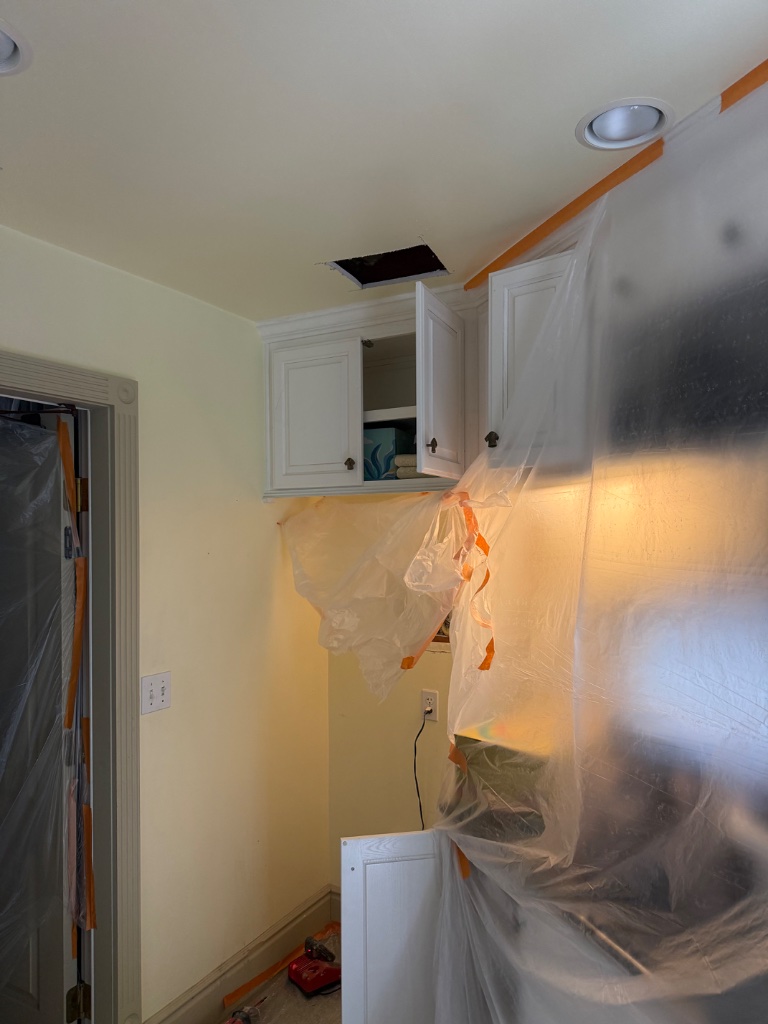 Hallway and rooms sealed with plastic barriers during repipe work