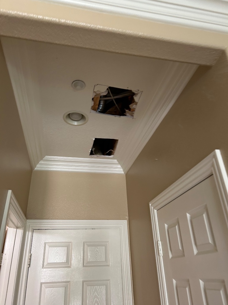 Entryway ceiling access holes for pipe routing during whole-home repipe