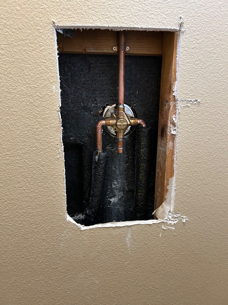 Shower valve access hole with new copper supply connections