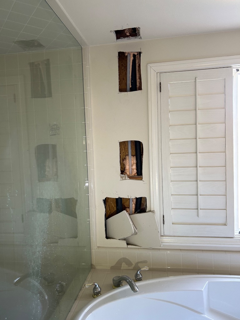 Staircase opening with new pipe routing and protection during repipe
