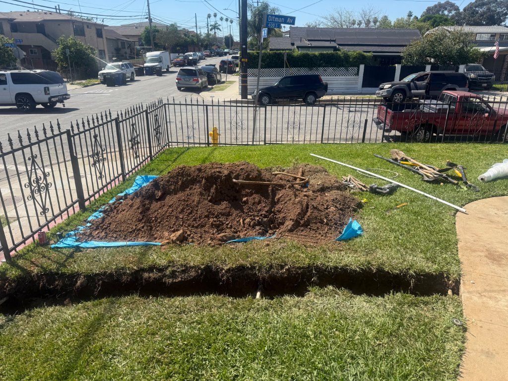 Excavation with tarps to protect lawn
