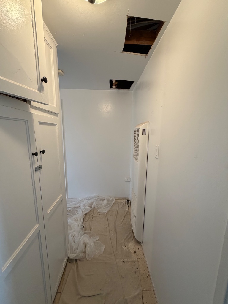 Exterior stucco patched after repipe access openings were completed