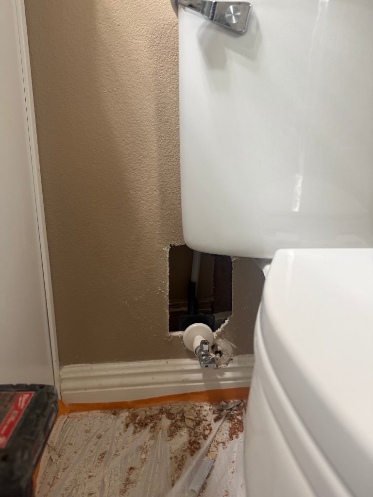 Small wall opening for toilet supply line replacement