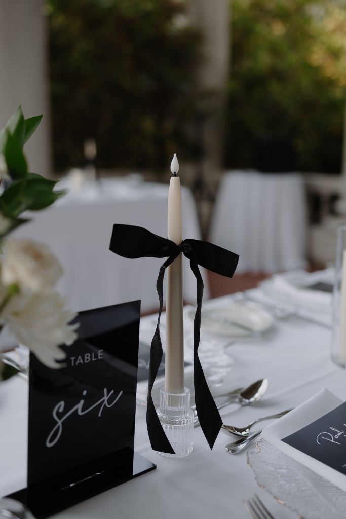 Candle with black bow detail