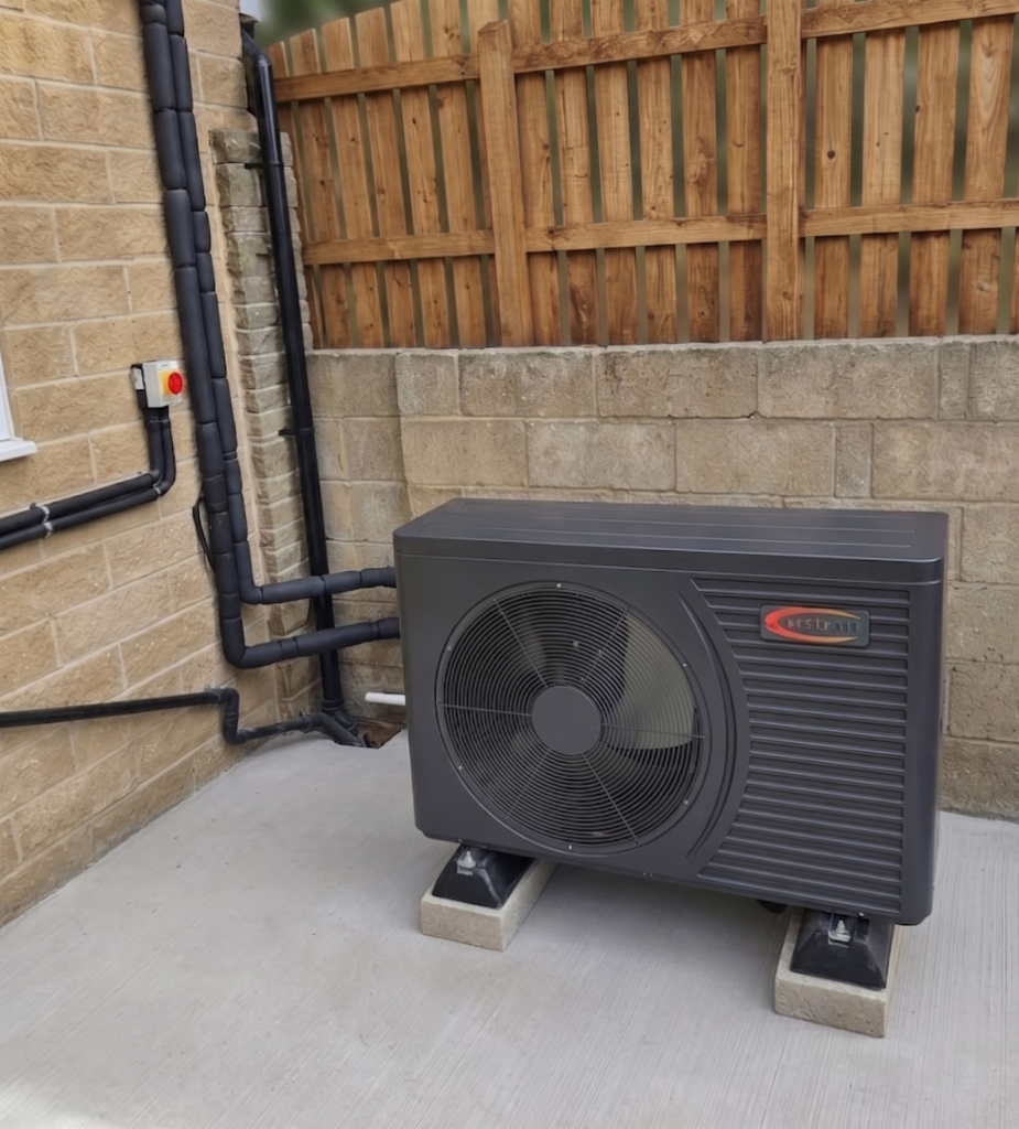 Air source heat pump installed on the exterior of a UK home