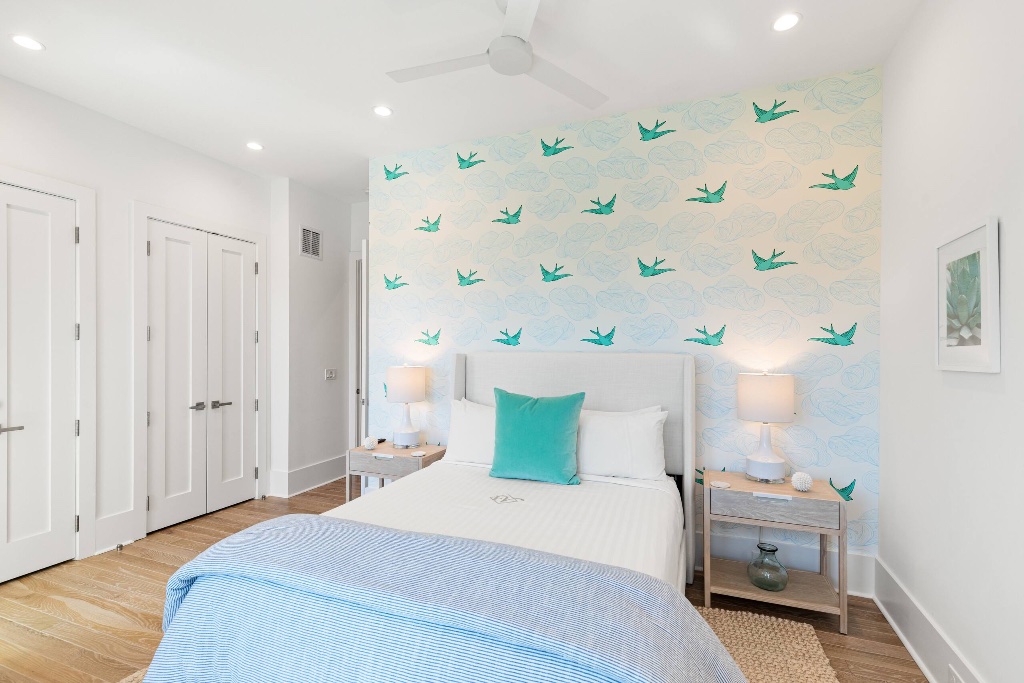 Bedroom with coastal swallow wallpaper