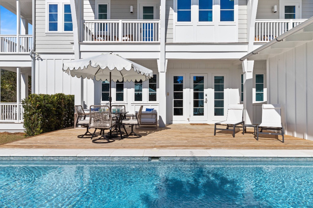 Pool and deck with coastal views