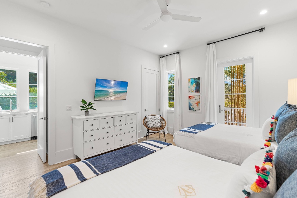 Twin bedroom with pom-pom accents
