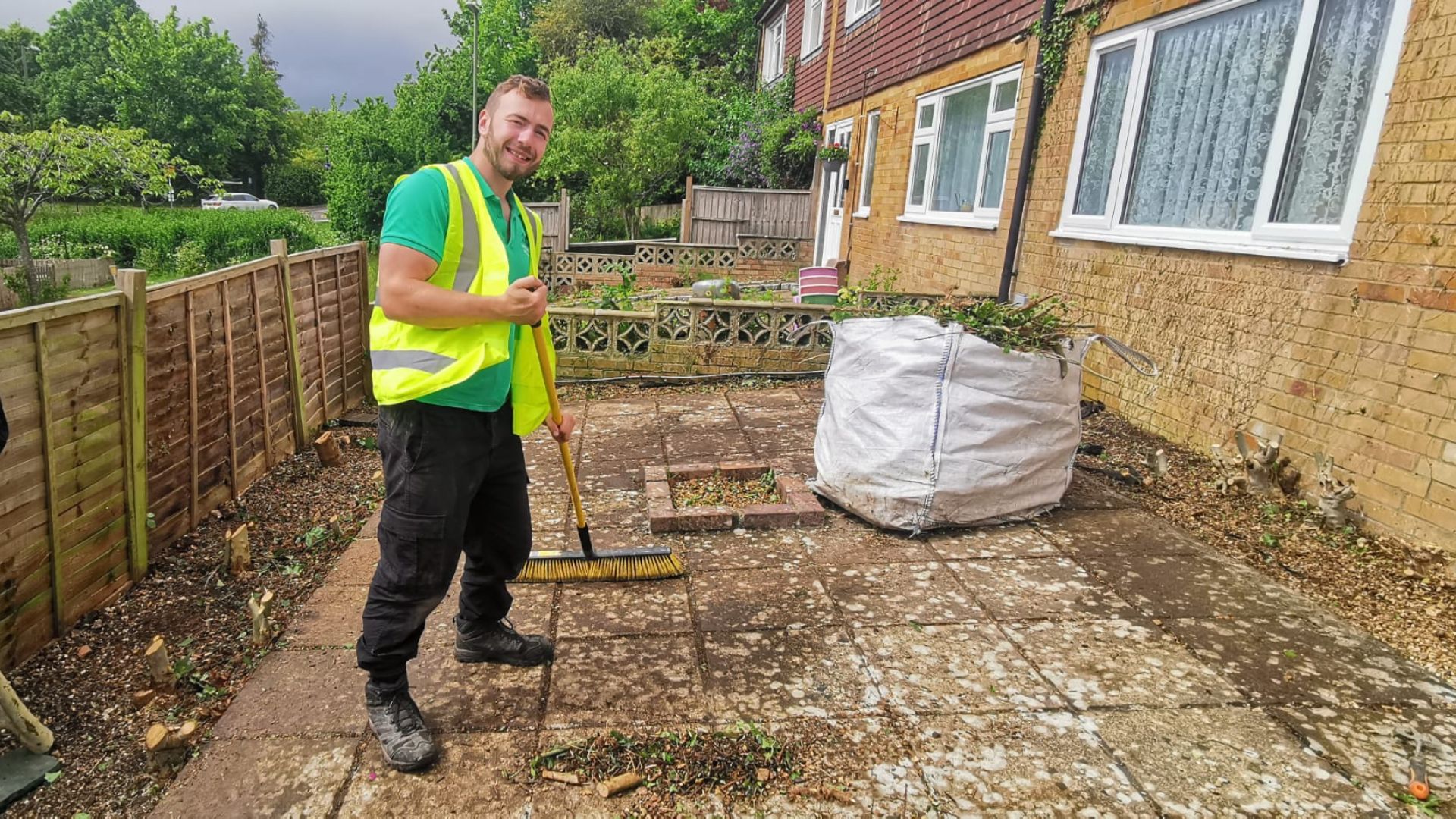 After - Overgrown shrubs and hedging cut back off a patio and path, all waste cleared - Basingstoke