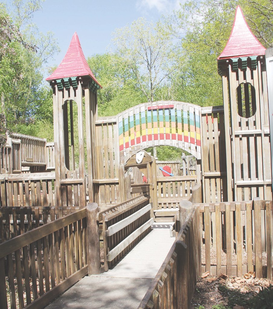 Davison Playscape with pink roof towers and colorful bridge