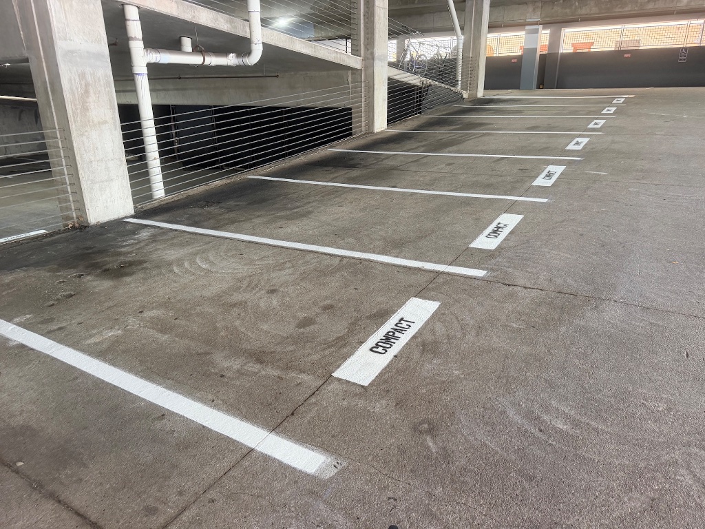 Parking garage compact stalls