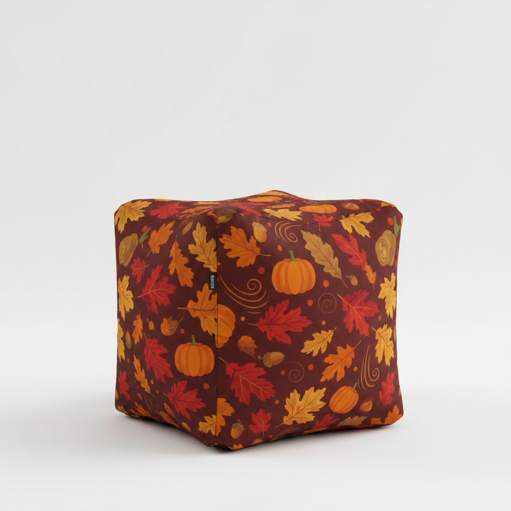 Seasonal fall design cube bean bag with leaves and pumpkins.