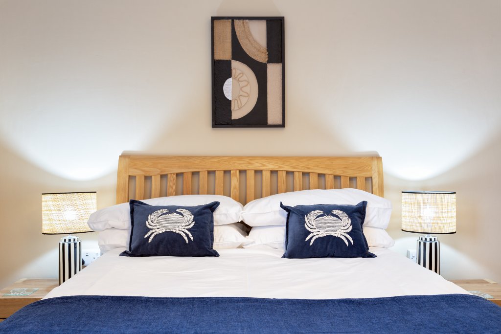 Double room with crab cushion detailing at Avoncourt Lodge