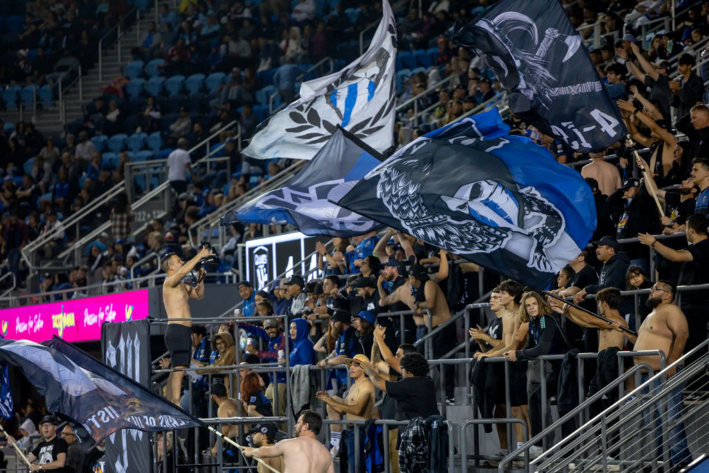 Supporter section with flags and atmosphere