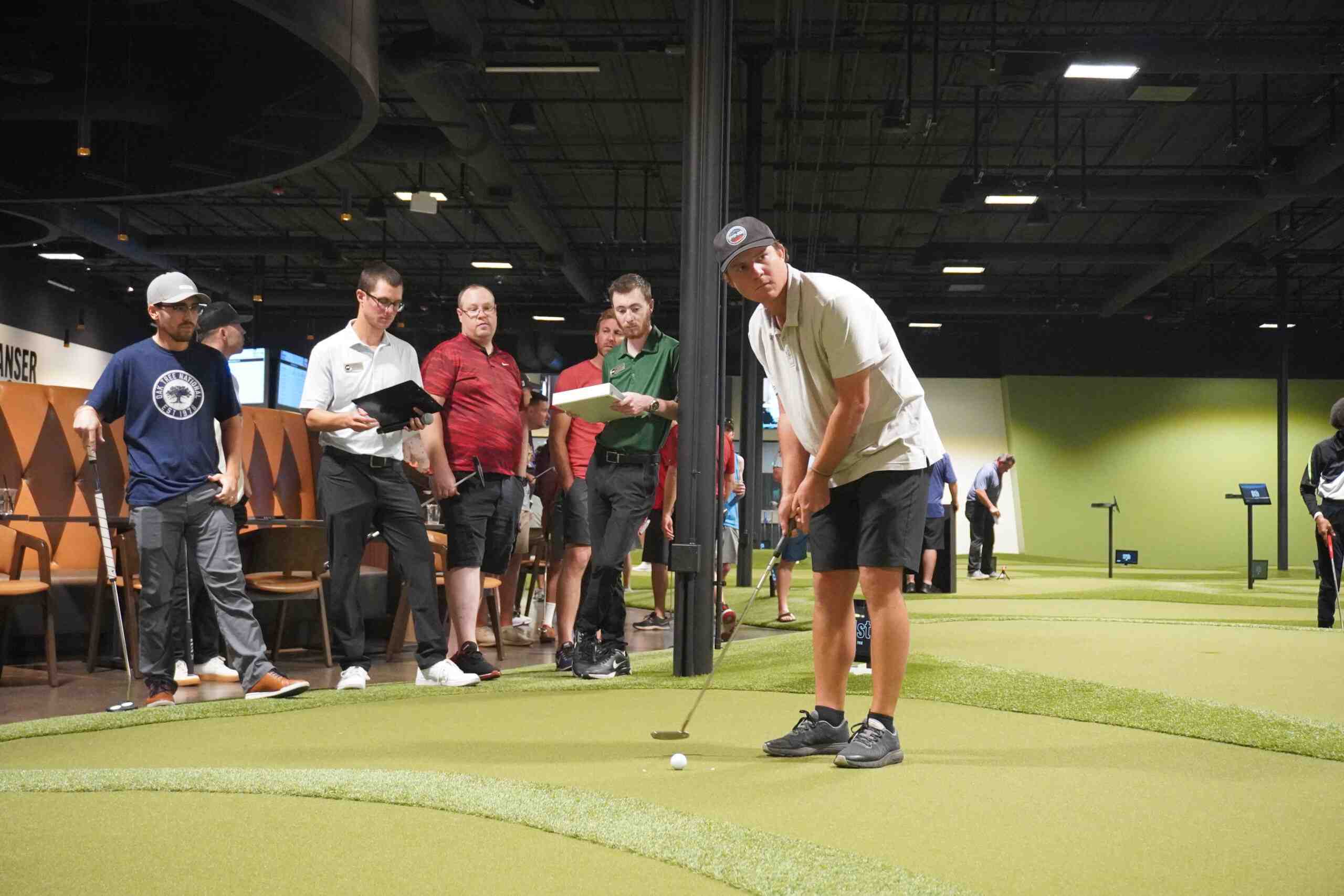 Golfer putting on the indoor Putting World course in Scottsdale