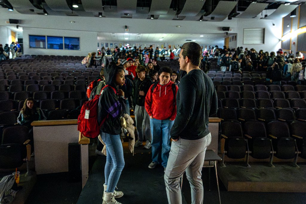 Stephen Hill connecting with students after assembly