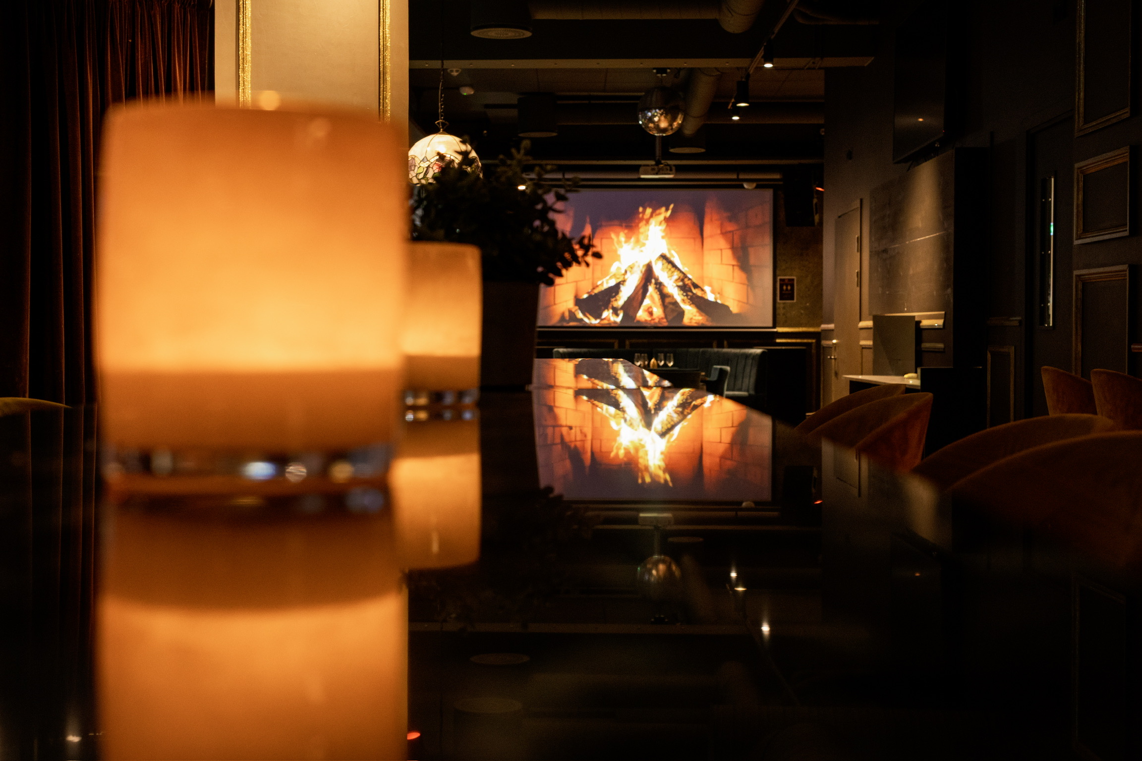 By the fireplace