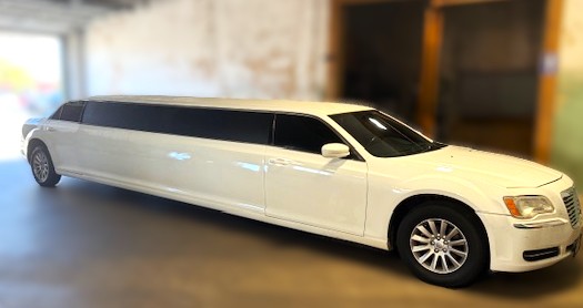 White stretch limousine Chrysler 300 at Capitol Glass