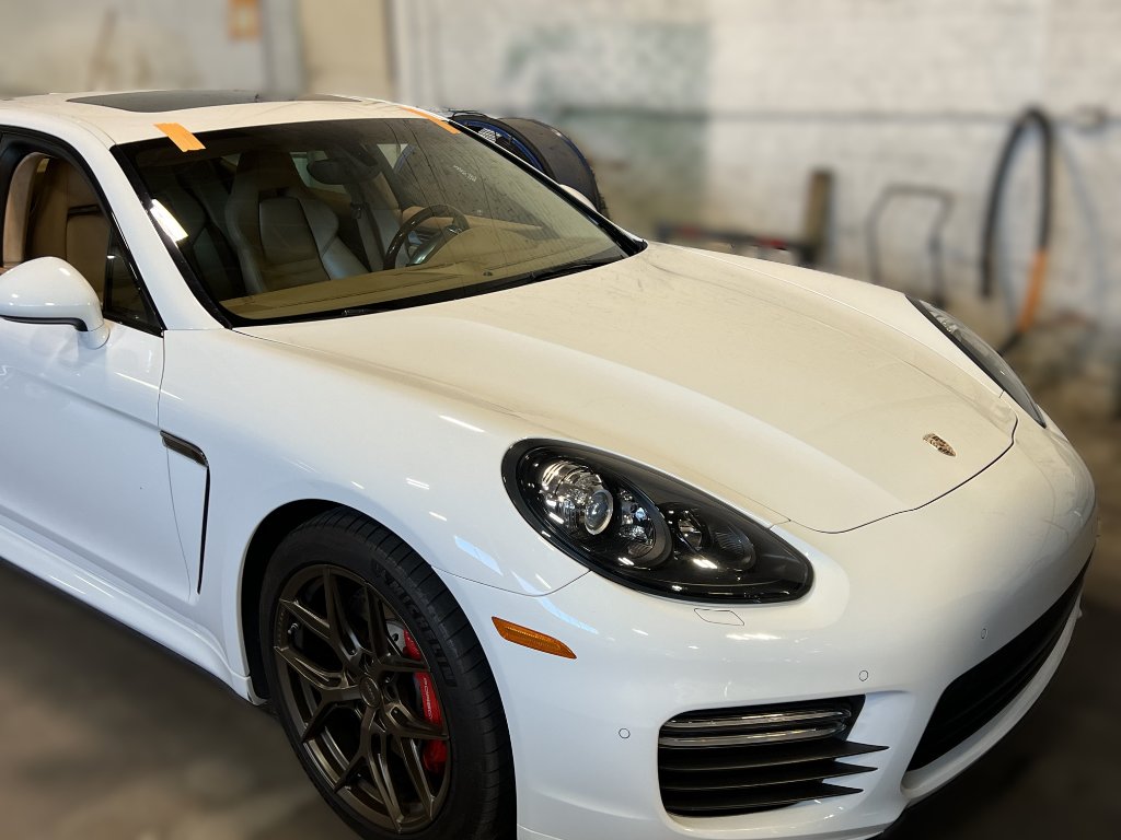 White Porsche Cayenne Turbo S at Capitol Glass shop