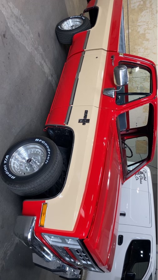 Classic red and tan Chevrolet Silverado square body at Capitol Glass
