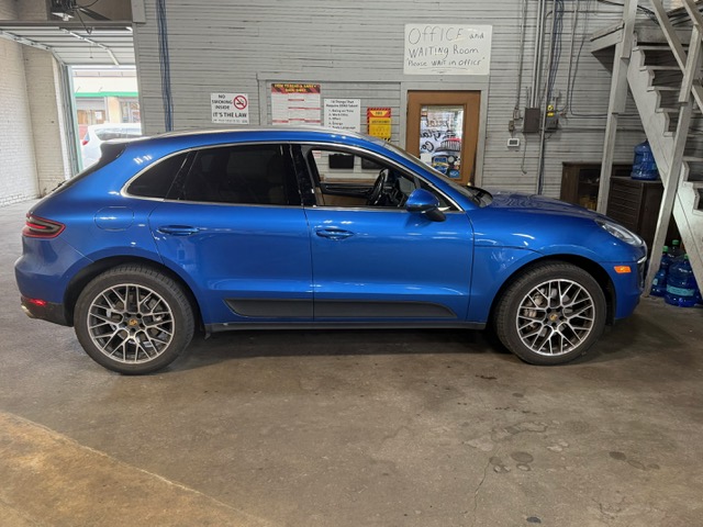 Blue Porsche Macan at Capitol Glass shop