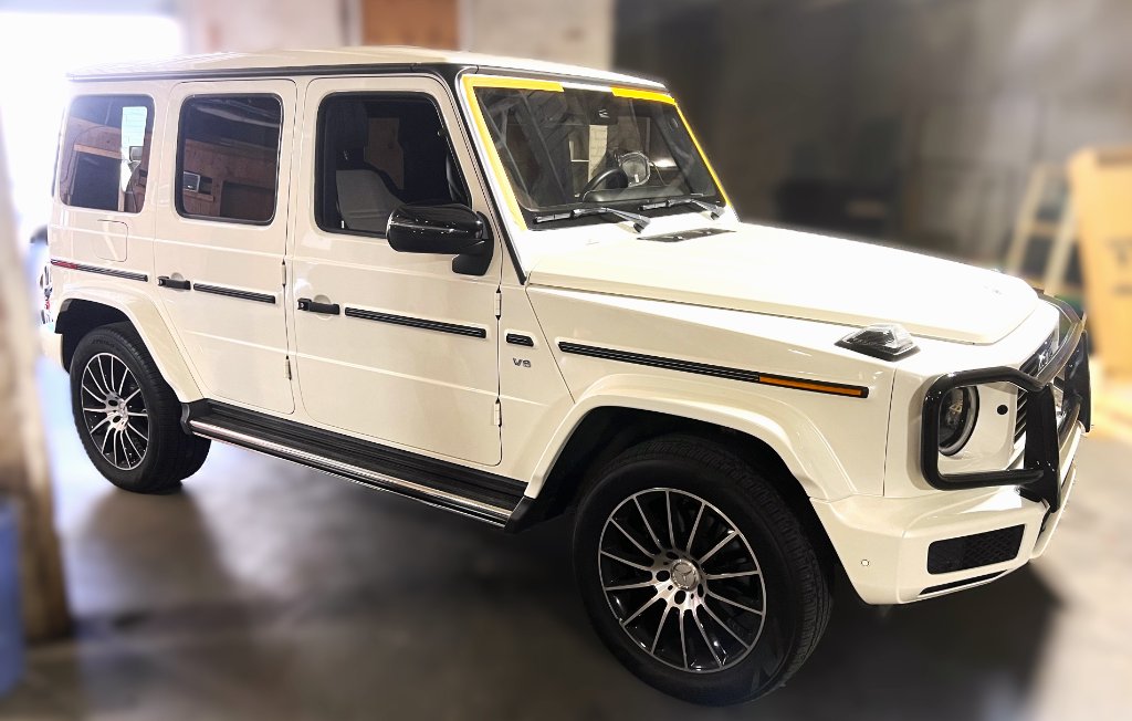 White Mercedes-Benz G550 G-Wagon windshield service at Capitol Glass