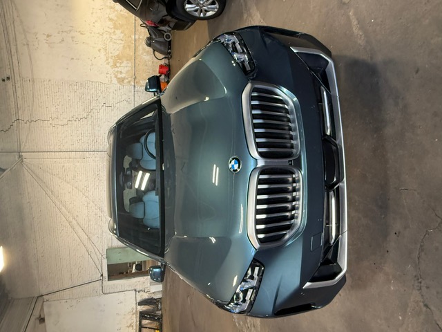 Teal BMW X5 windshield replacement at Capitol Glass