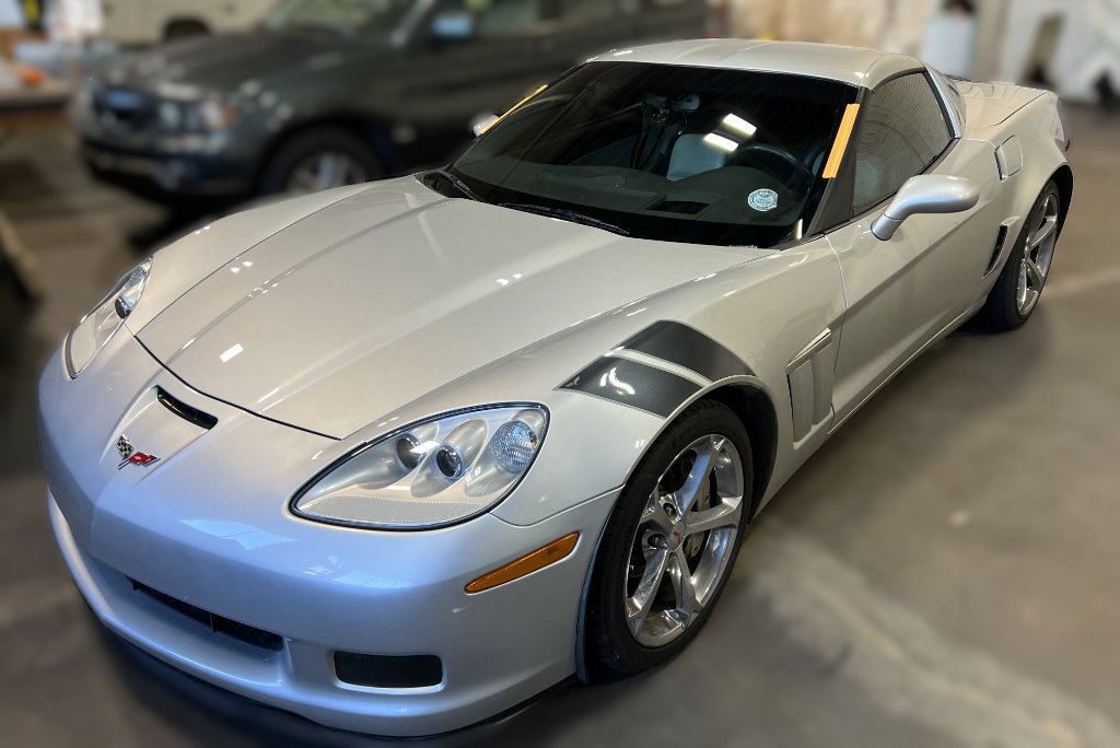 Silver Chevrolet Corvette Grand Sport in Capitol Glass shop