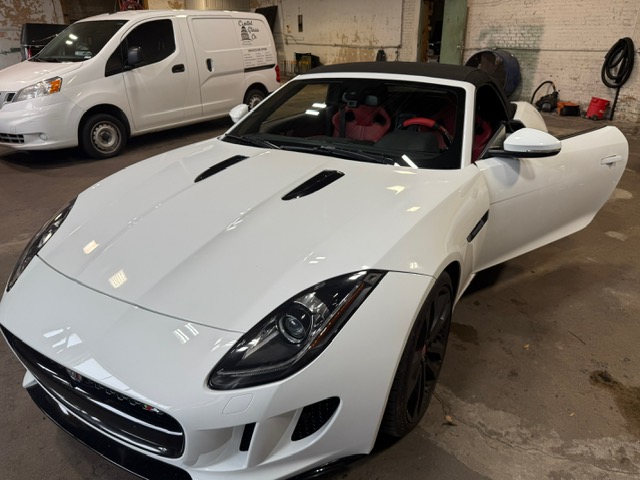 White Jaguar F-Type convertible with red interior at Capitol Glass