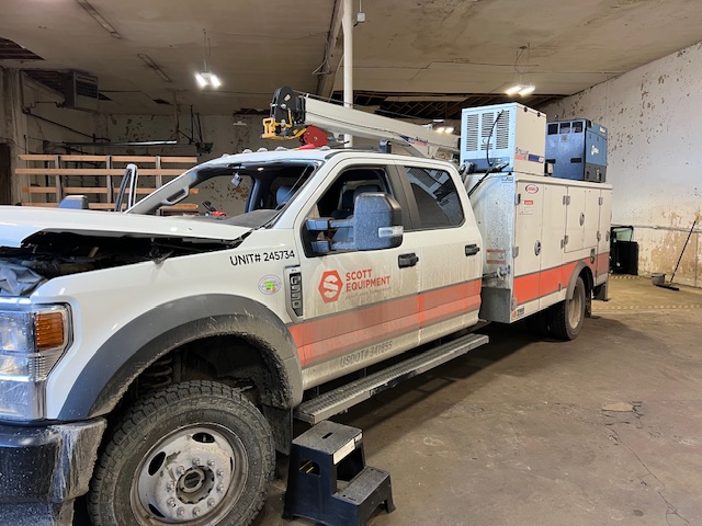 Scott Equipment white Ford F-550 service truck at Capitol Glass