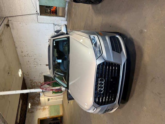 Silver Audi Q3 at Capitol Glass shop
