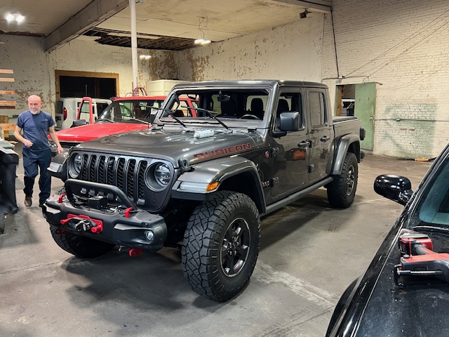 Gray Jeep Gladiator Rubicon in Capitol Glass shop