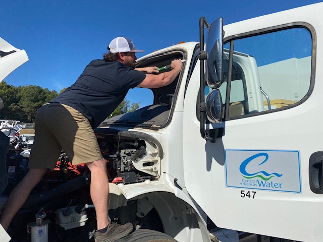 Technician replacing glass on Central Arkansas Water fleet truck