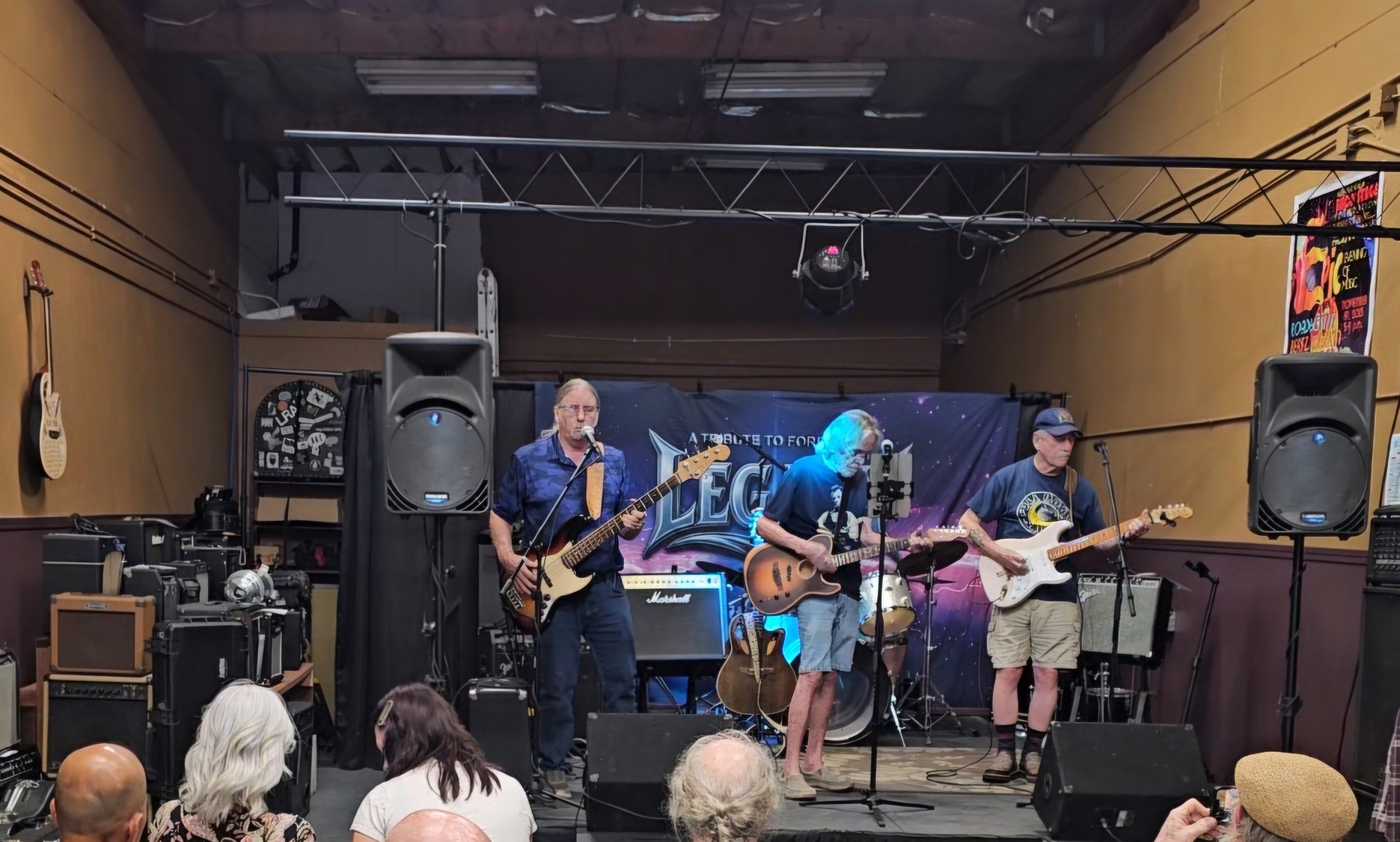 Iguana Music stage with a band performing