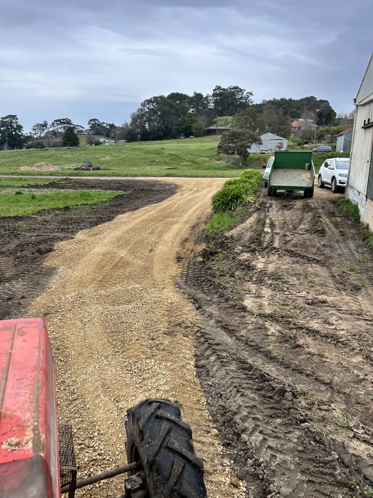 Gravel path taking shape around the garden beds.