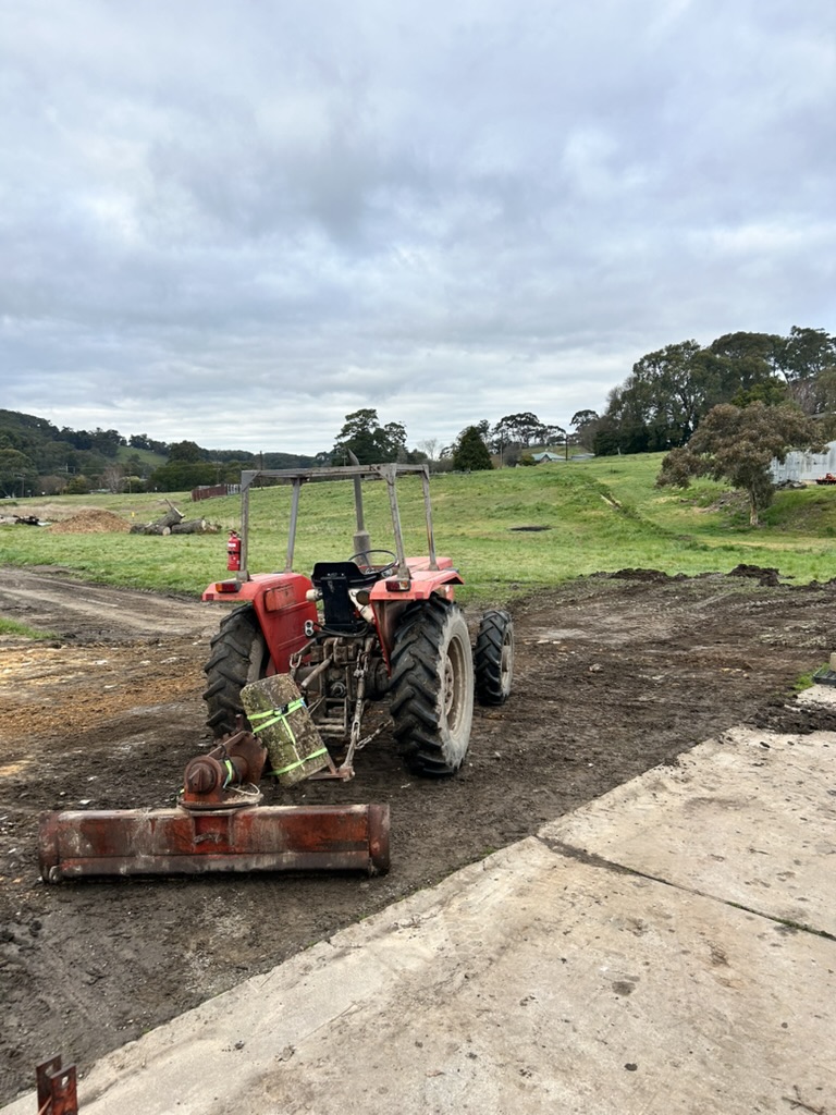 Grading the track with the tractor blade.