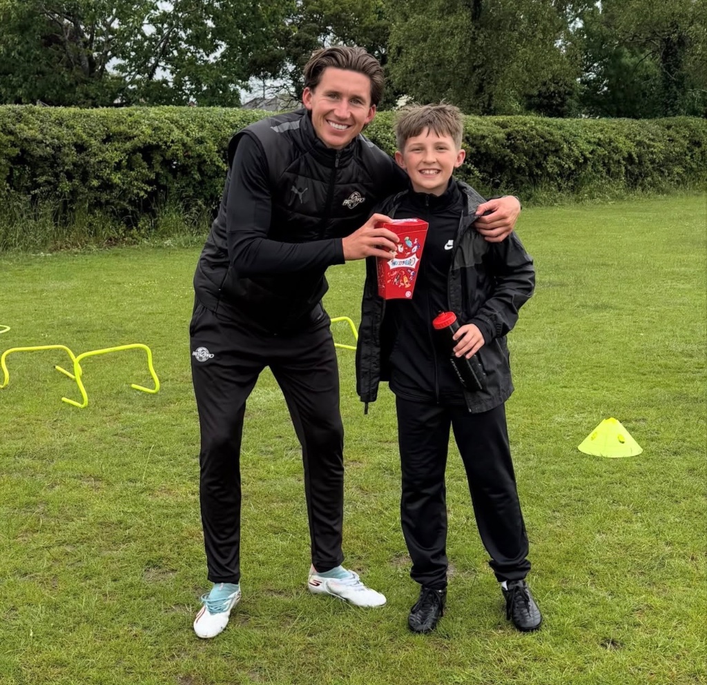 A Limitless Provision mentor with a young person after a sports session