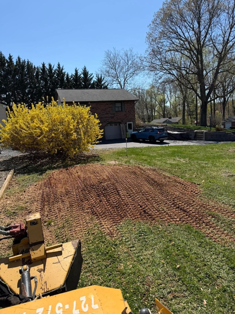 Tilled and graded lawn area ready for seeding in Harford County